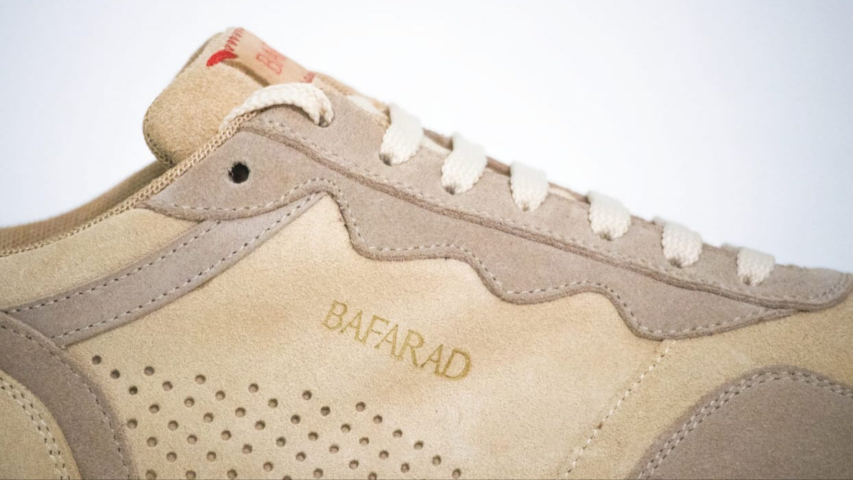 Beige sneaker with 'BAPFARAD' branding on a light gray background