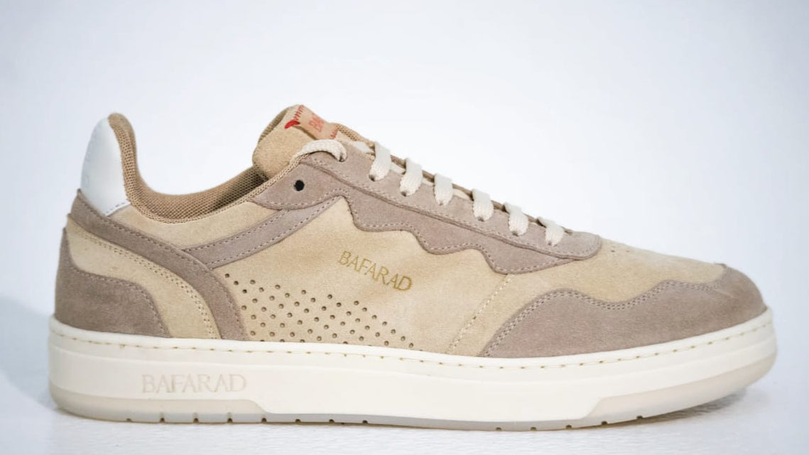 Beige sneaker with white sole on a light gray background